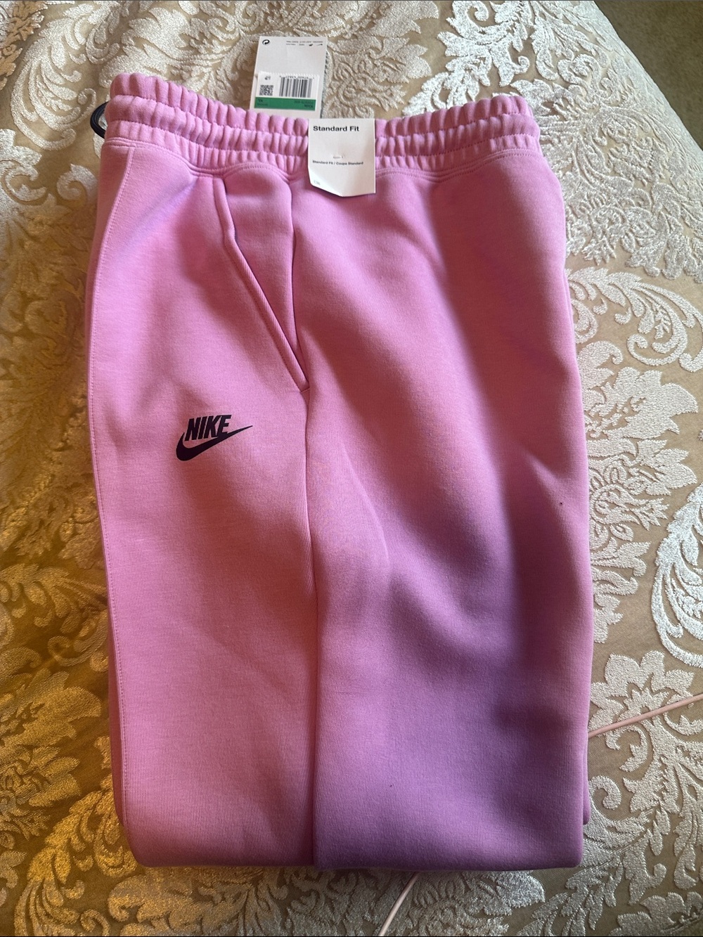 Nike Pink Joggers with Black Logo. KUD’s Size XL. Can fit an adult small/medium.